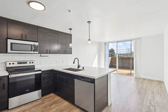 A modern kitchen with a black and white color scheme.