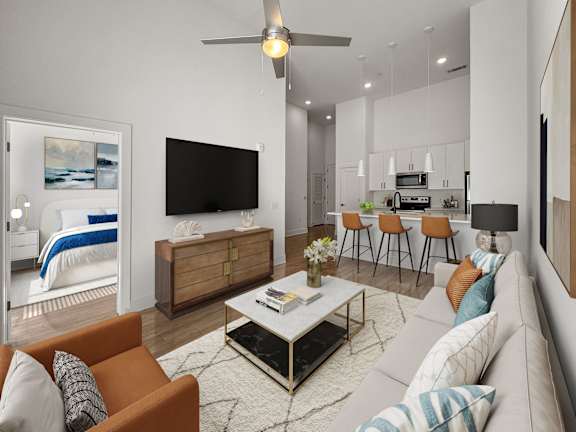 A modern living room with a television, a sofa, and a coffee table.
