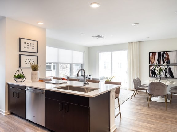 a kitchen and living room with a large counter top at The Grove at Piscataway, NJ