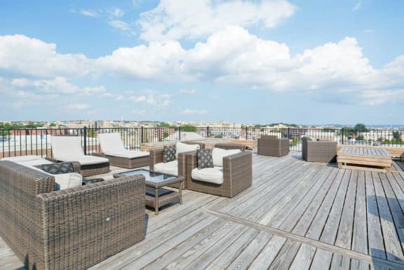 A rooftop deck with lounge chairs  at 1841 Columbia Road Apartments, Washington, DC, 20009
