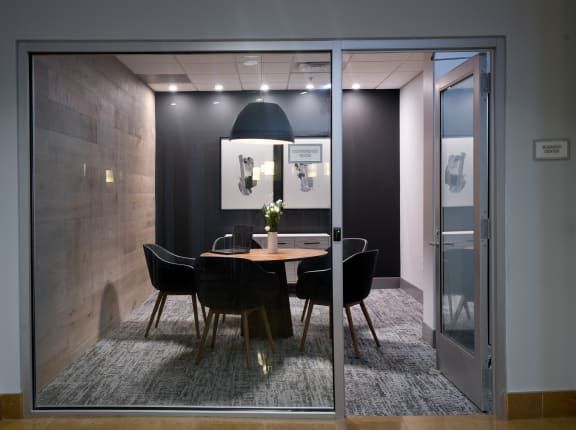a meeting room with glass doors