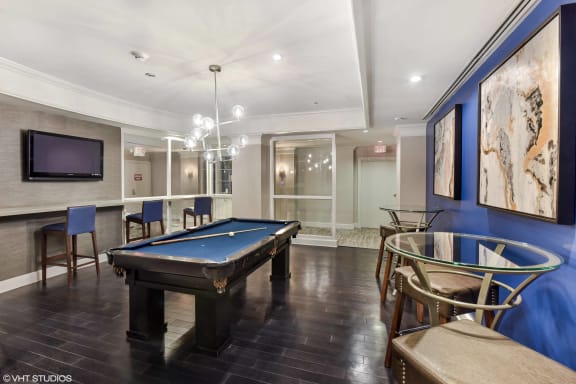 a game room with a pool table and a tv at The Chesapeake, Washington