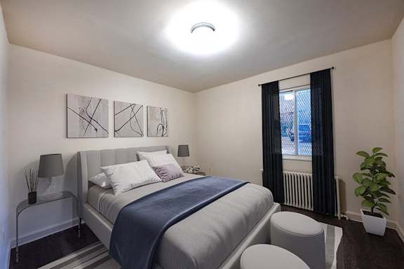 a small bedroom with a bed and a window