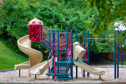 a colorful playground with a slide and other toys