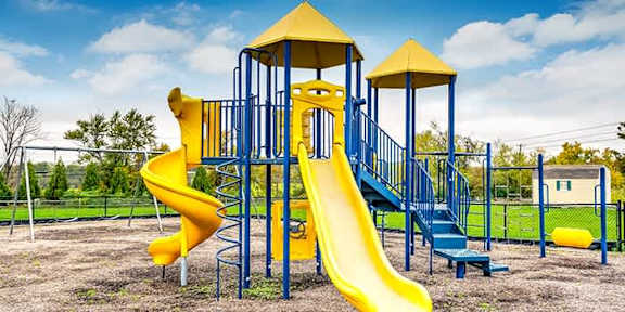 Playground with Yellow Slide at The Villages at Belle Hill, Elkton