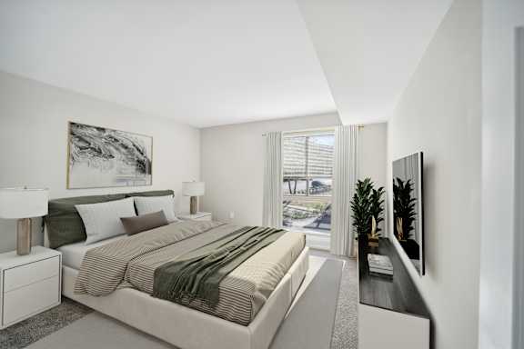 A bedroom with a large bed and a painting on the wall.