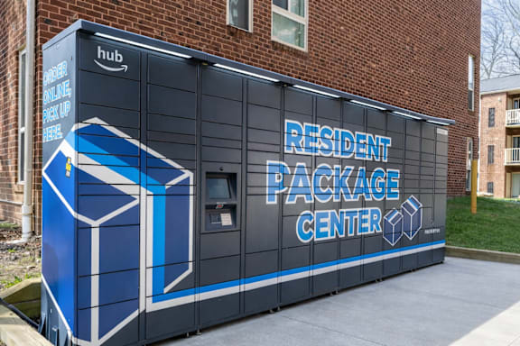 A brick building with a sign that says "Resident Package Center".