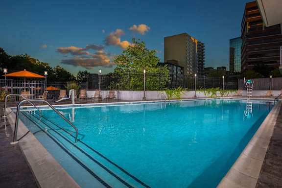 A swimming pool with a metal ladder on the side.
