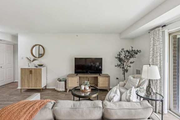 Living Room With TV at Aspen at Lake Trail, Columbia, MD