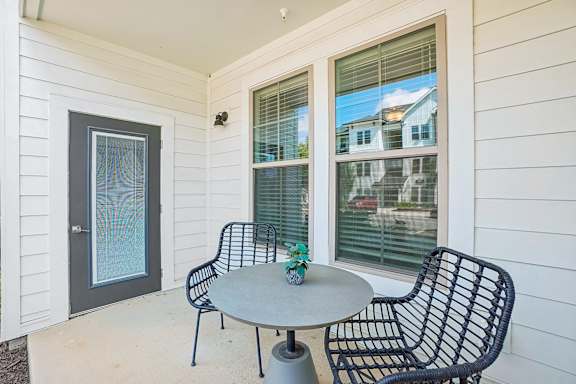 A patio with a table and chairs is shown.