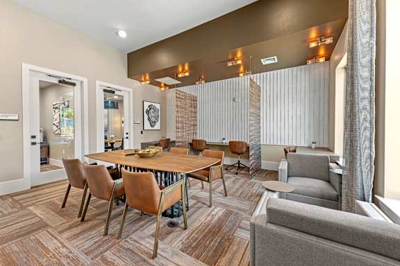 A modern dining room with a wooden table and chairs.