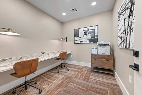 A room with a brown chair and a brown wood floor.