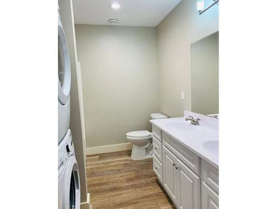 A white sink is on a countertop in a bathroom. at Briarcliff at Quechee, Vermont, 05059
