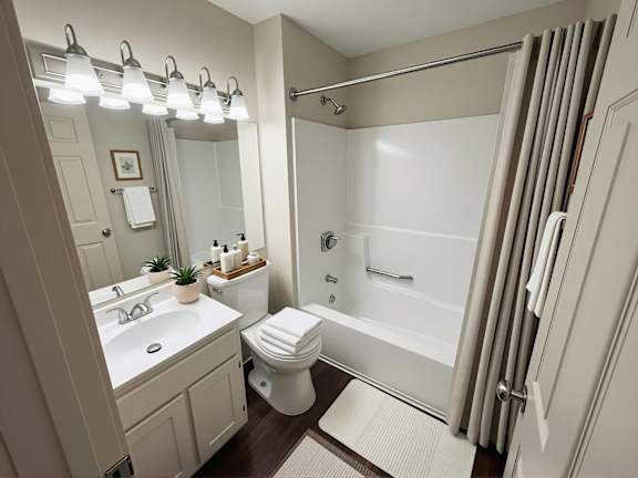 A bathroom with a white toilet, sink, and shower.