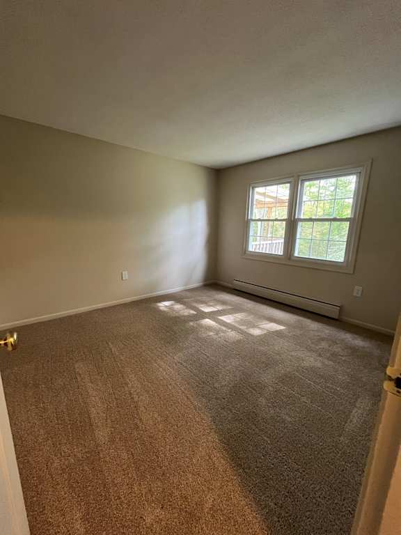 Bedroom with a window and a carpeted floor at Summit Terrace at Woodland, Cape Elizabeth, ME