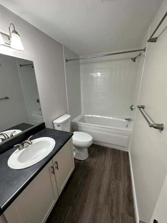 a bathroom with a sink and a toilet and a shower at Carisbrooke at Manchester Apartments, Manchester, NH
