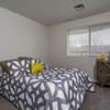 a bedroom with a bed and a window at Carisbrooke at Manchester Apartments, Manchester, 03102