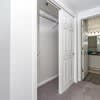 a white hallway with a door to a closet at Carisbrooke at Manchester Apartments, Manchester