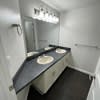 a bathroom with a sink and a mirror in it at Carisbrooke at Manchester Apartments, New Hampshire, 03102