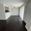 a empty room with a wooden floor in it at Carisbrooke at Manchester Apartments, Manchester, NH
