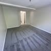 a empty room with wood flooring in a house at Carisbrooke at Manchester Apartments, Manchester