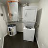a small bathroom with a toilet and a trash can at Carisbrooke at Manchester Apartments, New Hampshire