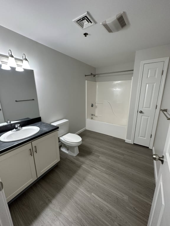 a bathroom with a sink and a toilet and a shower at Carisbrooke at Manchester Apartments, New Hampshire, 03102