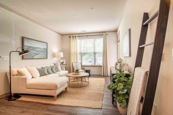 a living room with a couch and a table at Century New Holland, Gainesville, Georgia