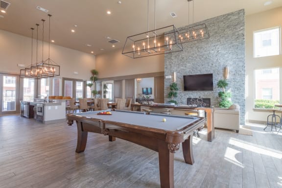 a clubhouse with a pool table and a tv at Century Palm Bluff, Portland, Texas
