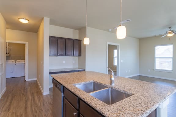 an empty kitchen with a sink and a counter top at Century Palm Bluff, Portland, TX