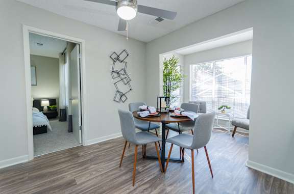 our apartments offer a dining room and living room with a large window at The Carter 4250 Apartments, Norcross, GA