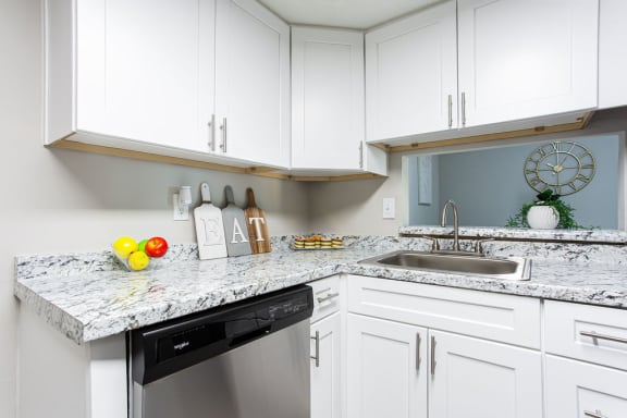 Kitchen With White Cabinetry And Appliances at The Cobb Apartments-Townhomes, Austell, GA
