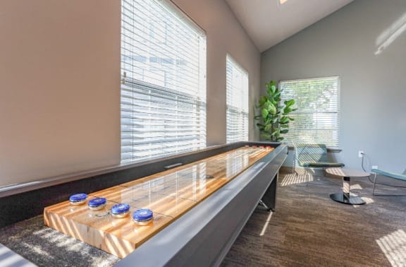 a room with a long counter with glasses on it