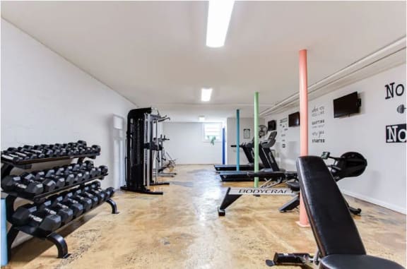 a room filled with lots of exercise equipment