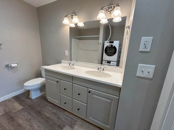 A bathroom with a white toilet and a white sink at Briarcliff at Quechee, Vermont  , 5059