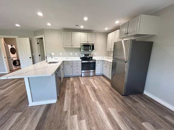 A kitchen with a white counter top and stainless steel appliances at Briarcliff at Quechee, Quechee, 5059