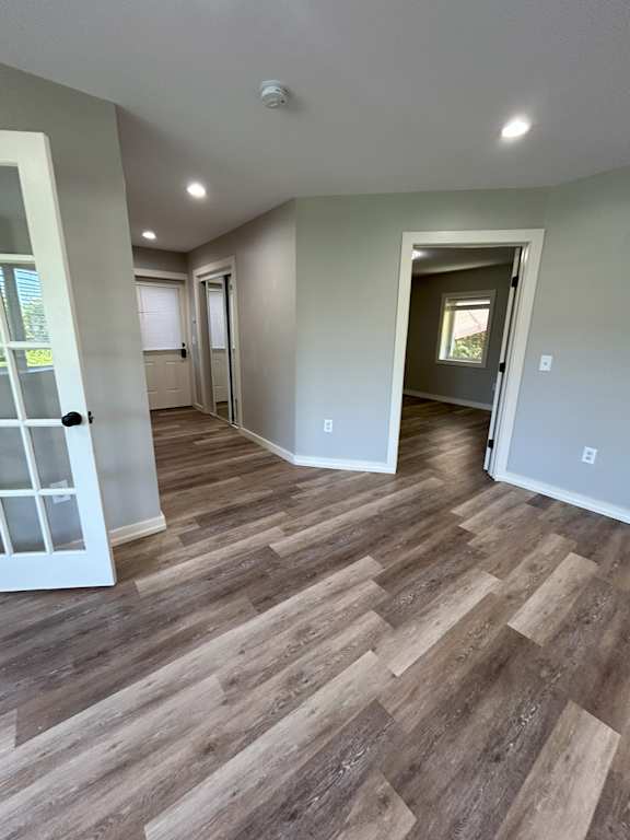 A room with wood flooring and white walls at Briarcliff at Quechee, Vermont