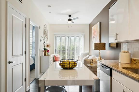 A kitchen with a white countertop and a ceiling fan.at Century Bridges, Roanoke, VA 24016