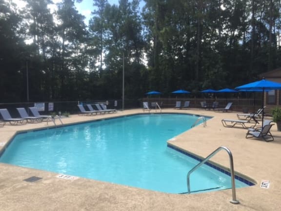 Pool With Sunning Deck at Riverwalk Vista Apartment Homes by ICER, South Carolina
