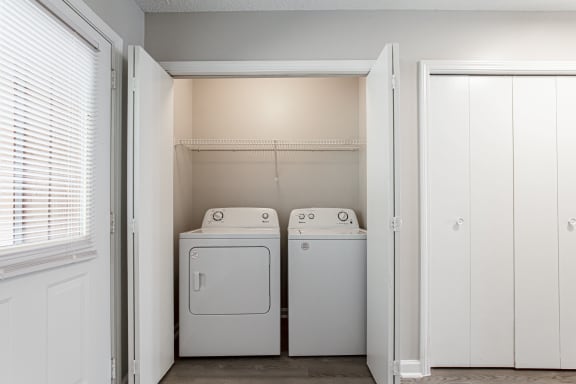 Full size washer and dryer in dedicated alcove at Salem Glen Apartments, Georgia