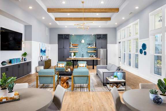 a living room with a kitchen and a dining room at Century Mundy Mill Apartments, Oakwood, GA 30566