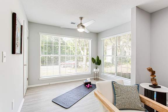 an empty living room with a yoga mat at Keita 1875, College Park, 30349