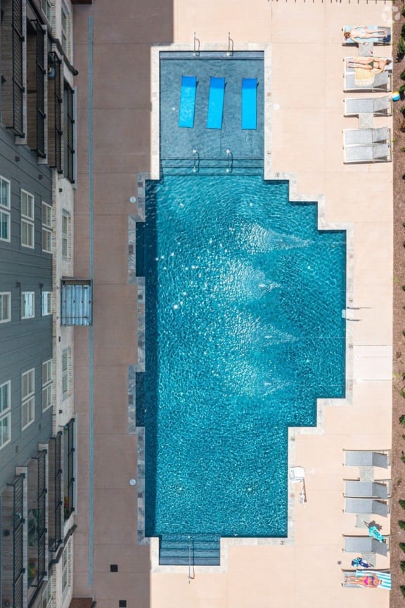 a swimming pool in the side of a building