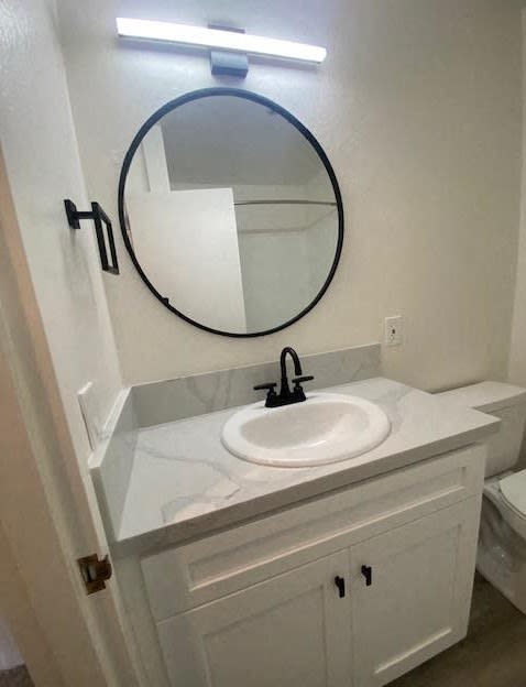 a bathroom with a sink and a mirror