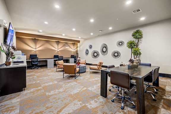 A conference room with a long table and chairs. at The Royce at 8100, Austin, Texas