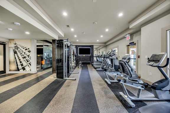 A gym with treadmills and elliptical machines. at Agave at South Congress, Austin, 78745