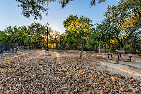 A park with a bench and a fence. at Bridge at Heritage Woods, Austin, TX, 78753