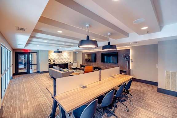 A conference room with a long table and chairs. at Bridge at Henley, Texas, 78741