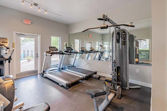 A gym with treadmills, weights, and exercise equipment. at Montecito, Texas