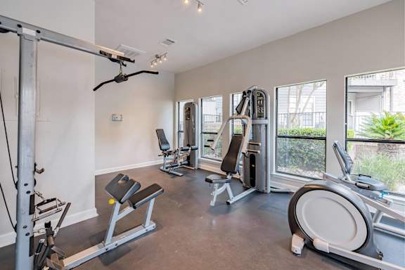 A well-equipped home gym with a variety of exercise machines. at Montecito, Texas